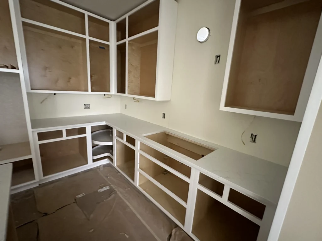 quartz countertops white with white cabinets.
