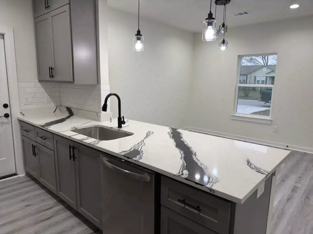 Quartz countertops, Tx Granite countertops, Tx Quartzite countertops Tx Quartz Countertops Houston TX. Granite Countertops Houston TX. Quartzite Countertops Houston TX. Marble Countertops Houston TX. Quartz Countertops Austin TX Granite Countertops Austin TX Quartzite Countertops Austin TX Marble Countertops Austin TX Quartz Countertops Bastrop TX Granite Countertops Bastrop TX Quartzite Countertops Bastrop TX Marble Countertops Bastrop TX Quartz Countertops College Station TX Granite Countertops College Station TX Quartzite Countertops College Station TX Marble Countertops College Station TX Quartz Countertops Bryan TX Granite Countertops Bryan TX Quartzite Countertops Bryan TX Marble Countertops Bryan TX. Granite countertops Quartz countertops Marble countertops Butcher block countertops Concrete countertops Soapstone countertops Laminate countertops Solid surface countertops Recycled glass countertops Stainless steel countertops Waterfall countertops Custom kitchen countertops Countertop installation Countertop replacement Affordable countertops Luxury kitchen countertops Eco-friendly countertops Heat-resistant countertops Scratch-resistant countertops White granite countertops Black quartz countertops Marble-look quartz countertops Modern kitchen countertops Rustic kitchen countertops Countertop contractors
Sleek open-plan kitchen with modern decor, featuring stainless appliances and bar seating.

Countertops TX, Quartz countertops TX, Granite countertops TX, Quartzite Countertops TX, Kitchen countertops, Quartz, Granite Countertops, Quartzite, Marble, Silestone, MSI, Countertops near me, Round Top, TX, Quartzite Countertops Katy, TX, Quartzite Countertops Sealy, TX, Quartzite Countertops Fulshear, TX, Quartzite Countertops Columbus, TX, Quartzite Countertops Bellville, TX, Quartzite Countertops Brenham, TX, Quartzite Countertops Round Top, TX, Quartzite Countertops Tomball, TX, Quartzite Countertops Eagle Lake, TX, Quartzite Countertops Wharton, TX, Quartzite Countertops El Campo, TX, Quartzite Countertops Clear Lake, TX, Quartzite Countertops Friendswood, TX, Quartzite Countertops Texas City, TX, Quartzite Countertops Pearland, TX, Quartzite Countertops Spring, TX, Quartzite Countertops Lake Jackson, TX, Quartzite Countertops Brazoria, TX, Quartzite Countertops West Columbia, TX, Quartzite Countertops Baytown, TX, Quartzite Countertops Kingwood, TX, Quartzite Countertops The Woodlands, TX, Quartzite Countertops Fort Bend County, TX, Quartzite Countertops Bay City, TX, Quartzite Countertops League City, TX, Quartzite Countertops Sugar Land, TX, Quartzite Countertops Hempstead, TX, Quartzite Countertops Richmond, TX, Quartzite Countertops Humble, TX, Quartzite Countertops Jersey Village, TX, Quartzite Countertops Cypress, TX, Quartzite Countertops Galveston, TX, Quartzite Countertops Cinco Ranch, TX, Quartzite Countertops Pecan Grove, TX, Quartzite Countertops Sienna, TX, Quartzite Countertops Hockley, TX, Quartzite Countertops Magnolia, TX, Quartzite Countertops Cleveland, TX, Quartzite Countertops Conroe, TX, Quartzite Countertops Montgomery, TX, Quartzite Countertops Rose Hill, TX, Quartzite Countertops West University Place, TX, Quartzite Countertops Kemah, TX, Quartzite Countertops Weston Lakes, TX, Quartzite Countertops Smithville, TX, Quartzite Countertops Bastrop, TX, Quartzite Countertops Austin, TX, Quartzite Countertops Anderson Mill, TX, Quartzite Countertops Cedar Park, TX, Quartzite Countertops Channelview, TX, Quartzite Countertops Clear Lake City, TX, Quartzite Countertops Crosby, TX, Quartzite Countertops Dayton, TX, Quartzite Countertops Deer Park, TX, Quartzite Countertops Dickinson, TX, Quartzite Countertops Freeport, TX, Quartzite Countertops Georgetown, TX, Quartzite Countertops Jamaica Beach, TX, Quartzite Countertops Jollyville, TX, Quartzite Countertops Kyle, TX, Quartzite Countertops Lakeway, TX, Quartzite Countertops Leader, TX, Quartzite Countertops Missouri City, TX, Quartzite Countertops Pasadena, TX, Quartzite Countertops Porter, TX, Quartzite Countertops Rosenberg, TX, Quartzite Countertops Rosharon, TX, Quartzite Countertops Round Rock, TX, Quartzite Countertops Santa Fe, TX, Quartzite Countertops Seabrook, TX, Quartzite Countertops Shenandoah, TX, Quartzite Countertops Stafford, TX, Quartzite Countertops Taylor, TX, Quartzite Countertops Waller, TX, Quartzite Countertops Webster, TX, Eco-friendly countertops, Acrylic countertops, Copper countertops, Durable countertops, Patterned countertops, Textured countertops, Budget countertops, Concrete overlay countertops, Modular countertops, Compact laminate countertops, Resin countertops, Cultured marble countertops, Countertop finishes, Non-porous countertops, Heat-tolerant countertops, Seamless countertops, Countertop restoration, Countertop makeover, Countertop design ideas, Countertop remodeling, Countertop installation cost, Countertop installers near me, Exotic stone countertops, Low-maintenance countertops, Modern kitchen countertops, Stone veneer countertops, Countertop moldings, Countertop transitions, Quartz countertops cost, Custom bathroom countertops, Countertop sealing services, Hygienic countertops, Scratch-proof countertops, Countertop upgrades, High-gloss countertops, Countertop overlays, Affordable kitchen countertops, Countertop showrooms, Removable countertops, Stone slab countertops, Reclaimed wood countertops, Contemporary countertops, Classic countertops, Decorative countertops, Countertop fabrication near me, Prefab countertops, Easy-to-clean countertops, Transitional countertops, UV-resistant countertops, Countertops near me, Granite countertops near me, Quartz countertops near me, Cheap countertops near me, Kitchen countertops near me, Bathroom countertops near me, Custom countertops near me, Affordable countertops near me, Local countertop installation, Countertop showrooms near me, Quartz Countertops Houston TX, Granite Countertops Houston TX, Quartzite Countertops Houston TX, Marble Countertops Houston TX, Luxury marble countertops for modern kitchens, Scratch-resistant quartz countertops for families, Custom edge designs for granite countertops, Best countertop options for small kitchen spaces, Low-maintenance countertop materials for busy homes, Where to buy pre-cut butcher block countertops, Top-rated kitchen countertop installers near me, How to clean and polish stone countertops, Budget-friendly countertop ideas for a kitchen upgrade, Heat- and stain-resistant countertops for outdoor use, Quartz Countertops Austin TX, Granite Countertops Austin TX, Quartzite Countertops Austin TX, Marble Countertops Austin TX, Quartz Countertops Bastrop TX, Granite Countertops Bastrop TX, Quartzite Countertops Bastrop TX, Marble Countertops Bastrop TX, Quartz Countertops College Station TX, Granite Countertops College Station TX, Quartzite Countertops College Station TX, Marble Countertops College Station TX, Quartz Countertops Bryan TX, Granite Countertops Bryan TX, Quartzite Countertops Bryan TX, Marble Countertops Bryan TX.

Granite Countertops – Near Austin, TX
Quartzite Countertops – Near Friendswood, TX
Marble & Stone Countertops – Nearby
Quartz Countertops – Austin, TX
Kitchen Countertops – Near Houston, TX
Quartz Countertops – Galveston, TX & Houston, TX
Quartz Countertops – Near Austin TX.
Quartz Countertops – Near Fulshear & Rosenberg, TX
Quartz Countertops – Missouri City, TX & Near Brenham, TX
Quartz Countertops – Baytown, TX
Quartz countertop installers in Bellville TX
Top-rated quartz countertops near Bellville TX
Affordable quartz countertops Bellville TX
White quartz countertops in Bellville TX homes
Best quartz countertop colors for kitchens in Bellville TX
Modern quartz countertops Bellville TX
Quartz countertop fabricators in Bellville TX
Polished quartz countertops near Bellville TX
Honed quartz countertops Bellville TX
Quartz countertop care and maintenance Bellville TX
Quartzite countertop installers in Bellville TX
Best quartzite colors for kitchens Bellville TX
Natural quartzite countertops near Bellville TX
Luxury quartzite countertops Bellville TX
Affordable quartzite countertop options in Bellville TX
Honed quartzite countertops Bellville TX
Quartzite bathroom countertops Bellville TX
Custom quartzite countertops Bellville TX
Outdoor quartzite countertops Bellville TX
Quartzite countertop fabricators Bellville TX
Granite Countertops Long-Tail Keywords – Bellville, TX
Granite countertop installers in Bellville TX
Top granite countertop colors Bellville TX
Affordable granite countertops Bellville TX
Best granite countertop companies in Bellville TX
Custom granite countertops Bellville TX
Black granite countertops Bellville TX
White granite countertops Bellville TX
Granite kitchen countertops Bellville TX
Granite countertop care Bellville TX
Honed granite countertops Bellville TX
Marble countertop installers Bellville TX
Top-rated marble countertops Bellville TX
Luxury marble countertops Bellville TX
Calacatta marble countertops Bellville TX
White marble countertops Bellville TX
Affordable marble countertops Bellville TX
Honed marble countertops Bellville TX
Marble bathroom countertops Bellville TX
Custom marble countertops Bellville TX
Best marble countertop care Bellville TX
Top-rated countertop installers Bellville TX
Affordable kitchen countertops Bellville TX
Custom countertops near Bellville TX
Quartz, granite, and marble countertops Bellville TX
Bathroom countertops Bellville TX
Outdoor kitchen countertops Bellville TX
Best countertop companies Bellville TX
Modern kitchen countertops Bellville TX
Countertop installation near Bellville TX
Residential and commercial countertops Bellville TX

Quartz countertop installers in Sealy TX
Top-rated quartz countertops near Sealy TX
Affordable quartz countertops Sealy TX
White quartz countertops for Sealy TX kitchens
Best quartz countertop colors for homes in Sealy TX
Modern quartz countertops Sealy TX
Custom quartz countertops near Sealy TX
Honed quartz countertops Sealy TX
Quartz countertop care and maintenance Sealy TX
Luxury quartz countertops Sealy TX
Quartzite countertop installers in Sealy TX
Best quartzite colors for kitchens Sealy TX
Natural quartzite countertops near Sealy TX
Luxury quartzite countertops Sealy TX
Affordable quartzite countertop options in Sealy TX
Honed quartzite countertops Sealy TX
Quartzite bathroom countertops Sealy TX
Outdoor quartzite countertops Sealy TX
Quartzite countertop fabricators Sealy TX
Custom quartzite slabs in Sealy TX
Granite countertop installers in Sealy TX
Top granite countertop colors Sealy TX
Affordable granite countertops Sealy TX
Custom granite countertops Sealy TX
Best granite countertop companies in Sealy TX
White granite countertops Sealy TX
Black granite countertops Sealy TX
Granite kitchen countertops Sealy TX
Granite countertop care and cleaning Sealy TX
Honed granite countertops Sealy TX
Marble countertop installers Sealy TX
Top-rated marble countertops Sealy TX
Luxury marble countertops Sealy TX
Calacatta marble countertops Sealy TX
White marble countertops Sealy TX
Affordable marble countertops Sealy TX
Marble bathroom countertops Sealy TX
Custom marble countertops Sealy TX
Honed marble countertops Sealy TX
Best marble countertop care Sealy TX
General Countertop Keywords – Sealy, TX
Top-rated countertop installers Sealy TX
Affordable kitchen countertops Sealy TX
Custom countertops near Sealy TX
Quartz, granite, and marble countertops Sealy TX
Bathroom countertops Sealy TX
Outdoor kitchen countertops Sealy TX
Best countertop companies Sealy TX
Modern kitchen countertops Sealy TX
Countertop installation near Sealy TX
Residential and commercial countertops Sealy TX


Quartz Countertops Sealy TX
Quartz Countertops Bellville TX
Quartz Countertop Installers Sealy TX
Quartz Countertop Installers Bellville TX
Top-Rated Quartz Countertops Sealy TX
Top-Rated Quartz Countertops Bellville TX
Custom Quartz Countertops Sealy TX
Custom Quartz Countertops Bellville TX
Affordable Quartz Countertops Sealy TX
Affordable Quartz Countertops Bellville TX
Quartzite Countertops
Quartzite Countertops Sealy TX
Quartzite Countertops Bellville TX
Quartzite Countertop Installers Sealy TX
Quartzite Countertop Installers Bellville TX
Top-Rated Quartzite Countertops Sealy TX
Top-Rated Quartzite Countertops Bellville TX
Custom Quartzite Countertops Sealy TX
Custom Quartzite Countertops Bellville TX
Affordable Quartzite Countertops Sealy TX
Affordable Quartzite Countertops Bellville TX
Granite Countertops
Granite Countertops Sealy TX
Granite Countertops Bellville TX
Granite Countertop Installers Sealy TX
Granite Countertop Installers Bellville TX
Top-Rated Granite Countertops Sealy TX
Top-Rated Granite Countertops Bellville TX
Custom Granite Countertops Sealy TX
Custom Granite Countertops Bellville TX
Affordable Granite Countertops Sealy TX
Affordable Granite Countertops Bellville TX
Marble Countertops
Marble Countertops Sealy TX
Marble Countertops Bellville TX
Marble Countertop Installers Sealy TX
Marble Countertop Installers Bellville TX
Top-Rated Marble Countertops Sealy TX
Top-Rated Marble Countertops Bellville TX
Custom Marble Countertops Sealy TX
Custom Marble Countertops Bellville TX
Affordable Marble Countertops Sealy TX
Affordable Marble Countertops Bellville TX.

Quartz Countertops On Sale Nearby
Affordable Quartz Countertops On Sale Nearby
Best Quartz Countertops On Sale Nearby
Custom Quartz Countertops On Sale Nearby
Modern Quartz Countertops On Sale Nearby
Luxury Quartz Countertops On Sale Nearby
Top-Rated Quartz Countertops On Sale Nearby
High-Quality Quartz Countertops On Sale Nearby
Quartz Countertops On Sale Nearby For Kitchens
Quartz Countertops On Sale Nearby For Bathrooms
Discount Quartz Countertops On Sale Nearby
Quartz Countertop Installers On Sale Nearby
Quartz Countertops On Sale Nearby With Free Installation
Quartz Countertops On Sale Nearby With No Deposit
Best Deals On Quartz Countertops On Sale Nearby
Quartz Countertops On Sale Nearby – Limited Time Offer
Quartz Countertops On Sale Nearby – Exclusive Discounts
Quartz Countertops On Sale Nearby – Get A Free Quote
Quartz Countertops On Sale Nearby – Top Deals Today
Quartz Countertops On Sale Nearby – Affordable Prices
Quartz Countertops On Sale Nearby – Best Value
Quartz Countertops On Sale Nearby – Shop Now
Quartz Countertops On Sale Nearby – Special Offers
Quartz Countertops On Sale Nearby – Limited Stock
Quartz Countertops On Sale Nearby – Order Today

Granite countertops near me
Quartz countertops near me
Marble countertops near me
Kitchen countertops near me
Bathroom countertops near me
Countertop installation near me
Countertop installers near me
Quartzite countertops near me
Custom countertops near me
Affordable countertops near me
Best countertops for kitchen near me
Granite vs quartz countertops near me
Countertop fabricators near me
Solid surface countertops near me
Countertop replacement near me
White quartz countertops near me
Black granite countertops near me
Countertop remodeling near me
Laminate countertops near me
Butcher block countertops near me


Countertop Installation Quartzite Countertops. Countertop Installation Calacatta Lorenzo Quartz Countertops Kingwood TX. Granite Countertops Kingwood TX. Quartzite Countertops Kingwood TX. Marble Countertops Kingwood TX. Quartz Countertops Houston TX. Granite Countertops Houston TX. Quartzite Countertops Houston TX. Marble Countertops Houston TX.

Countertops QUARTZ, granite, quartzite. Katy, Sealy, Fulshear, Columbus, Bellville, Brenham, Tomball, Eagle Lake, Wharton, El Campo, Clear Lake, Friendswood, Texas City, Pearland, Spring, Lake Jackson, Brazoria, West Columbia, Baytown, Kingwood, The Woodlands, Fort Bend County, Bay City, League City Texas. Sugar Land, Hempstead, Richmond, Humble, Jersey Village, Cypress, Galveston, Cinco Ranch, Pecan Grove, Sienna, Hockley, Magnolia, Cleveland, Conroe, Montgomery, Rose Hill, West University Place, Kemah, Weston Lakes, Smithville, Bastrop. Harris County, Fort Bend County, Waller County, Brazoria County, Galveston County, Montgomery County, Austin County, Colorado County, Wharton County, Travis County, Williamson County, Hays County Austin, Anderson Mill, Cedar Park, Channelview, Clear Lake City, Crosby, Dayton, Deer Park, Dickinson, Freeport, Georgetown, Jamaica Beach, Jollyville, Kyle, Lakeway, Leader, Missouri City, Pasadena, Porter, Rosenberg, Rosharon, Round Rock, Santa Fe, Seabrook, Shenandoah, Stafford, Taylor, Waller, Webster. Near me.

Countertops (Quartz, Granite, Quartzite, Marble, Cambria, Silestone)
Home, Kitchen, and Bathroom Remodeling
Custom Cabinet Installation
Backsplashes and Shower Renovations
Popular Countertop Edge Profiles

🔹 Countertops (Quartz, Granite, Quartzite, Marble, Cambria, Silestone)
Affordable quartz countertops in [City]
Best granite countertop installers near me
Custom marble countertops for kitchens
Quartzite countertops with waterfall edge design
Cambria quartz countertops installation services
Silestone countertops for modern bathrooms
Durable granite countertops for outdoor kitchens
White quartz countertops with grey veining
Black granite countertops for contemporary kitchens
Eco-friendly recycled glass countertops
Cambria® Quartz Surfaces

Cambria® Quartz Surfaces

🔹 Home Remodeling
Full home renovation services in [Sealy, Tx]
Energy-efficient home remodeling contractors
Modern home remodel ideas for small spaces
Luxury home renovation specialists near me
Affordable whole-house remodeling solutions
Historic home restoration and remodeling
Open-concept home remodeling designs
Home addition and remodeling contractors
Smart home integration in remodeling projects
Custom home remodeling with sustainable materials

🔹 Kitchen Remodeling
Custom kitchen remodeling services in [Sealy, Tx]
Modern kitchen renovation ideas with islands
Affordable kitchen remodel packages
Luxury kitchen remodeling with high-end finishes
Small kitchen remodel solutions for apartments
Kitchen cabinet refacing and replacement
Open-concept kitchen remodeling designs
Kitchen backsplash installation services
Energy-efficient kitchen appliances installation
Custom pantry design and installation

🔹 Bathroom Remodeling
Bathroom remodeling contractors in [Sealy, Tx]
Walk-in shower installation and design
Custom bathroom vanities and countertops
Luxury bathroom remodel with spa features
Small bathroom renovation ideas
Accessible bathroom remodeling services
Bathroom tile installation and repair
Eco-friendly bathroom remodeling solutions
Bathroom lighting and fixture upgrades
Heated flooring installation in bathrooms
Kitchen Remodel 
Cambria® Quartz Surfaces

Better Homes & Gardens
🔹 Custom Cabinet Installation
Custom kitchen cabinet design and installation
Bathroom cabinet installation services
Built-in storage solutions for living rooms
Custom closet systems and organizers
Home office custom cabinetry
Garage storage cabinets installation
Entertainment center custom cabinets
Laundry room cabinet installation
Pantry cabinet design and installation
Mudroom built-in cabinets and benches
🔹 Backsplashes and Shower Renovations
Kitchen backsplash tile installation services
Glass mosaic backsplash designs
Subway tile backsplash installation
Custom shower tile installation and design
Walk-in shower remodeling services
Frameless glass shower enclosure installation
Waterproofing solutions for showers
Shower niche and bench installation
Natural stone shower wall installation
LED lighting installation in showers
🔹 Popular Countertop Edge Profiles
Eased edge countertop design
Beveled edge countertops for kitchens
Bullnose edge granite countertop installation
Ogee edge marble countertops
Mitered edge quartz countertops
Dupont edge profile for kitchen islands
Double radius edge countertop design
Waterfall edge quartzite countertops
Half bullnose edge granite installation
Custom countertop edge profiles
Kitchen remodel near me
Affordable kitchen remodel near me
Luxury kitchen remodel near me
Small kitchen remodel near me
Kitchen cabinet installation near me
Custom kitchen remodel near me
Kitchen design services near me
Open concept kitchen remodel near me
Kitchen backsplash installation near me
Kitchen island installation near me
Modern kitchen remodel near me
Farmhouse kitchen remodel near me
Kitchen contractors near me
Complete kitchen renovation near me
High-end kitchen remodel near me
Kitchen flooring install near me
Galley kitchen remodel near me
Energy-efficient kitchen remodel near me
Kitchen pantry renovation near me
Kitchen remodel consultation near me
Breathe New Life Into Your Home with Beautiful Countertops and Remodeling Done Right
Thinking about updating your kitchen, bathroom, or even the whole house? You don’t have to settle for outdated spaces or worn-out finishes. Whether you’re planning a full home renovation or just looking to upgrade your countertops, we’re here to make your vision a reality—with craftsmanship you can trust and materials that truly last.

Our team specializes in custom countertop installation, offering popular and durable options like quartz, granite, marble, and quartzite. From clean, modern quartz in your kitchen to classic marble in the bathroom, we’ll help you choose the perfect surface to match your style and the way you live.

A kitchen remodel is one of the best ways to add value to your home—and make it a place you actually enjoy spending time in. Picture a spacious island with waterfall edges, soft-close drawers, and sleek, durable countertops ready for everyday cooking and entertaining. For bathrooms, we can transform your space with updated vanities, modern sinks, and natural stone surfaces that combine beauty with function.

We handle everything—from the design and material selection to demo, prep, and installation. Whether it’s a small upgrade or a full-scale renovation, we’re committed to making the process smooth and stress-free.
Price range 2000 to 3,000+ Per slab

Countertops Granite countertops, quartz countertops, Countertop installer, Granite, Quartz, Quartzite, Silestone, Caesar Stone, MSI, Marble Countertops Katy, TX, Marble Countertops Sealy, TX, Marble Countertops Fulshear, TX, Marble Countertops Columbus, TX, Marble Countertops Bellville, TX, Marble Countertops Brenham, TX, Marble Countertops Round Top, TX, Marble Countertops Tomball, TX, Marble Countertops Eagle Lake, TX, Marble Countertops Wharton, TX, Marble Countertops El Campo, TX, Marble Countertops Clear Lake, TX, Marble Countertops Friendswood, TX, Marble Countertops Texas City, TX, Marble Countertops Pearland, TX, Marble Countertops Spring, TX, Marble Countertops Lake Jackson, TX, Marble Countertops Brazoria, TX, Marble Countertops West Columbia, TX, Marble Countertops Baytown, TX, Marble Countertops Kingwood, TX, Marble Countertops The Woodlands, TX, Marble Countertops Fort Bend County, TX, Marble Countertops Bay City, TX, Marble Countertops League City, TX, Marble Countertops Sugar Land, TX, Marble Countertops Hempstead, TX, Marble Countertops Richmond, TX, Marble Countertops Humble, TX, Marble Countertops Jersey Village, TX, Marble Countertops Cypress, TX, Marble Countertops Galveston, TX, Marble Countertops Cinco Ranch, TX, Marble Countertops Pecan Grove, TX, Marble Countertops Sienna, TX, Marble Countertops Hockley, TX, Marble Countertops Magnolia, TX, Marble Countertops Cleveland, TX, Marble Countertops Conroe, TX, Marble Countertops Montgomery, TX, Marble Countertops Rose Hill, TX, Marble Countertops West University Place, TX, Marble Countertops Kemah, TX, Marble Countertops Weston Lakes, TX, Marble Countertops Smithville, TX, Marble Countertops Bastrop, TX, Marble Countertops Austin, TX, Marble Countertops Anderson Mill, TX, Marble Countertops Cedar Park, TX, Marble Countertops Channelview, TX, Marble Countertops Clear Lake City, TX, Marble Countertops Crosby, TX, Marble Countertops Dayton, TX, Marble Countertops Deer Park, TX, Marble Countertops Dickinson, TX, Marble Countertops Freeport, TX, Marble Countertops Georgetown, TX, Marble Countertops Jamaica Beach, TX, Marble Countertops Jollyville, TX, Marble Countertops Kyle, TX, Marble Countertops Lakeway, TX, Marble Countertops Leader, TX, Marble Countertops Missouri City, TX, Marble Countertops Pasadena, TX, Marble Countertops Porter, TX, Marble Countertops Rosenberg, TX, Marble Countertops Rosharon, TX, Marble Countertops Round Rock, TX, Marble Countertops Santa Fe, TX, Marble Countertops Seabrook, TX, Marble Countertops Shenandoah, TX, Marble Countertops Stafford, TX, Marble Countertops Taylor, TX, Marble Countertops Waller, TX, Marble Countertops Webster, TX, Countertop Installer Katy, TX, Countertop Installer Sealy, TX, Countertop Installer Fulshear, TX, Countertop Installer Columbus, TX, Countertop Installer Bellville, TX, Countertop Installer Brenham, TX, Countertop Installer Round Top, TX, Countertop Installer Tomball, TX, Countertop Installer Eagle Lake, TX, Countertop Installer Wharton, TX, Countertop Installer El Campo, TX, Countertop Installer Clear Lake, TX, Countertop Installer Friendswood, TX, Countertop Installer Texas City, TX, Countertop Installer Pearland, TX, Countertop Installer Spring, TX, Countertop Installer Lake Jackson, TX, Countertop Installer Brazoria, TX, Countertop Installer West Columbia, TX, Countertop Installer Baytown, TX, Countertop Installer Kingwood, TX, Countertop Installer The Woodlands, TX, Countertop Installer Fort Bend County, TX, Countertop Installer Bay City, TX, Countertop Installer League City, TX, Countertop Installer Sugar Land, TX, Countertop Installer Hempstead, TX, Countertop Installer Richmond, TX, Countertop Installer Humble, TX, Countertop Installer Jersey Village, TX, Countertop Installer Cypress, TX, Countertop Installer Galveston, TX, Countertop Installer Cinco Ranch, TX, Countertop Installer Pecan Grove, TX, Countertop Installer Sienna, TX, Countertop Installer Hockley, TX, Countertop Installer Magnolia, TX, Countertop Installer Cleveland, TX, Countertop Installer Conroe, TX, Countertop Installer Montgomery, TX, Countertop Installer Rose Hill, TX, Countertop Installer West University Place, TX, Countertop Installer Kemah, TX, Countertop Installer Weston Lakes, TX, Countertop Installer Smithville, TX, Countertop Installer Bastrop, TX, Countertop Installer Austin, TX, Countertop Installer Anderson Mill, TX, Countertop Installer Cedar Park, TX, Countertop Installer Channelview, TX, Countertop Installer Clear Lake City, TX, Countertop Installer Crosby, TX, Countertop Installer Dayton, TX, Countertop Installer Deer Park, TX, Countertop Installer Dickinson, TX, Countertop Installer Freeport, TX, Countertop Installer Georgetown, TX, Countertop Installer Jamaica Beach, TX, Countertop Installer Jollyville, TX, Countertop Installer Kyle, TX, Countertop Installer Lakeway, TX, Countertop Installer Leader, TX, Countertop Installer Missouri City, TX, Countertop Installer Pasadena, TX, Countertop Installer Porter, TX, Countertop Installer Rosenberg, TX, Countertop Installer Rosharon, TX, Countertop Installer Round Rock, TX, Countertop Installer Santa Fe, TX, Countertop Installer Seabrook, TX, Countertop Installer Shenandoah, TX, Countertop Installer Stafford, TX, Countertop Installer Taylor, TX, Countertop Installer Waller, TX, Countertop Installer Webster, TX, White granite countertops, Blue quartz countertops, Gray marble countertops, Black countertops, Brown granite countertops, Beige quartz countertops, Glossy black countertops, Polished granite countertops, Matte black countertops, Green quartz countertops. White & Light Granite Colors: Alaska White – White with gray and beige veining Bianco Romano – White with light gray and brown flecks Colonial White – Off-white with soft gray and red specks River White – Bright white with gray veining and red accents White Ice – White with blue-gray veins and dark flecks Kashmir White – Creamy white with soft gray and black spots Moon White – Soft white with subtle gray movement Snowfall – White with dramatic gray veins Avalanche White – Pure white with light gray texture Viscount White – Grayish-white with swirling patterns Gray & Neutral Granite Colors: Steel Gray – Mid-tone gray with consistent texture Silver Cloud – Light gray with white and black veins Gray Mist – Soft gray with subtle movement Fantasy Gray – Gray with flowing marble-like patterns Azul Platino – Gray with silver and black flecks Dove Gray – Light gray with creamy undertones Titanium Gray – Dark gray with bold patterns Pebble Gray – Textured gray with earthy tones Coastal Gray – Soft gray with brown veining Mystic Gray – Cool gray with blue undertones Beige, Cream & Warm Granite Colors: Santa Cecilia – Warm beige with gold, black, and burgundy flecks Giallo Ornamental – Creamy beige with light gray movement New Venetian Gold – Warm gold with brown veining Colonial Gold – Soft cream with golden highlights Ivory Fantasy – Light beige with gray and burgundy accents Golden Crystal – Creamy beige with dramatic veins Sienna Beige – Warm beige with dark brown veining Desert Gold – Sandy beige with gold and black specks Harvest Gold – Golden tones with white veining Toasted Almond – Beige with soft golden highlights Black & Dark Granite Colors: Absolute Black – Solid black with a polished finish Black Galaxy – Black with golden specks Cosmic Black – Black with white and gold swirls Ubatuba – Dark green-black with gold flecks Black Pearl – Black with subtle silver and gray patterns Agatha Black – Black with bold white veining Jet Mist – Black with soft gray movement Obsidian – Deep black with fine specks Nero Mist – Charcoal black with white veining Midnight Gold – Black with golden accents Exotic & Bold Granite Colors: Blue Bahia – Bright blue with white and gray swirls Emerald Pearl – Dark green with iridescent flecks Red Dragon – Deep red with black and gray veins Verde Butterfly – Green with light green and gold accents Typhoon Bordeaux – Creamy beige with red and gray veins Fusion Granite – A mix of blue, green, and gold swirls Netuno Bordeaux – Creamy base with burgundy and gold highlights Ice Blue – Blue-gray with white veins Fire Bordeaux – Red and gold tones with bold movement Lennon Blue – Blue and gray with consistent texture. White & Light Granite Colors Alaska White – A soft white with gentle gray veining, offering a timeless and neutral backdrop. Colonial White – A creamy white with delicate gray and black specks, ideal for clean, elegant designs. Bianco Antico – A white granite with silver, beige, and rose tones, creating a sophisticated, soft contrast. Kashmir White – A luxurious light gray and white stone with flecks of black and gold. White Ice – A cool white granite with silver and black patterns, offering a sleek and modern aesthetic. Alpine White – A pure white granite with subtle gray and beige veins for a neutral, clean look. Ivory Fantasy – A warm ivory-colored granite with hints of soft golden veins for a welcoming and elegant appeal. Arctic Ice – A pale white granite with soft gray veining, perfect for creating a clean and minimalist environment. Polar White – A pristine white granite with subtle gray and black specks, ideal for modern spaces. Snow White – A bright white granite with light veining, perfect for kitchens and bathrooms in need of a fresh look. Gray Granite Colors Silver Cloud – A light gray granite with soft silver veins, perfect for contemporary interiors. Steel Gray – A rich, medium gray granite with deep black and silver speckles, ideal for bold designs. Smoky Pearl – A cool gray granite with subtle veining and a touch of shimmer, adding elegance to any space. Cinder Gray – A dark gray granite with smoky veining and hints of white, offering a dramatic look. Cosmic Gray – A galaxy-inspired dark gray granite with silver flecks, perfect for luxurious modern kitchens. Storm Gray – A deep, stormy gray with darker veins, offering a sophisticated, moody vibe. Mystic Gray – A sleek, mid-tone gray granite with subtle white veining for a serene and refined look. Graphite – A deep, almost black gray granite with a smooth texture, perfect for modern and industrial spaces. Pewter – A neutral gray with silver undertones, ideal for creating sleek and understated designs. Shadow Gray – A soft, medium-gray granite with light veining, perfect for creating subtle contrast. Beige & Cream Granite Colors Crema Bordeaux – A beige granite with warm golden veins and dark burgundy accents, perfect for traditional designs. Giallo Veneziano – A creamy, light beige granite with hints of gold and brown for a warm, inviting feel. Golden Cream – A rich cream granite with golden veins, perfect for a warm and luxurious kitchen countertop. Tropical Brown – A light beige granite with hints of brown and black flecks, perfect for rustic or traditional spaces. Taj Mahal – A luxurious beige granite with subtle veining and natural swirls of soft gold. Maple Cream – A soft, creamy beige granite with a hint of brown, offering a warm, classic look. Champagne Beige – A light beige with subtle, golden undertones that provide a calm and refined atmosphere. Ivory Beige – A neutral beige with light tan and ivory tones, ideal for creating a balanced, clean space. Sand Cream – A sandy beige granite with a warm, earthy feel, perfect for coastal or rustic designs. Beige Valley – A beige granite with streaks of light brown and cream, offering a natural, calming look. Brown Granite Colors Sierra Brown – A deep brown granite with rich golden veins, perfect for creating a bold, sophisticated design. Coffee Brown – A dark brown granite with red and black flecks, offering a luxurious and warm tone. Bainbrook Brown – A rich brown granite with tan and gold veins, ideal for adding depth and warmth to spaces. Nutmeg – A medium-brown granite with lighter streaks and a soft, subtle finish, perfect for traditional kitchens. Chocolate Brown – A dark brown granite with swirls of black and gold, perfect for bold, luxurious countertops. Copper Canyon – A medium-brown granite with coppery undertones, offering a unique, rustic appeal. Giallo Fiorito – A golden-brown granite with flecks of black and gray, ideal for adding depth to your kitchen. Royal Brown – A deep brown granite with rich patterns and golden highlights, providing a luxurious feel. Tiger Skin Brown – A medium-brown granite with black and orange veining, giving a dynamic and natural appearance. Cafe Brown – A dark, almost black brown granite with a smooth finish and subtle streaks of gray. Black Granite Colors Absolute Black – A deep, rich black granite with a sleek, polished finish for high-end kitchens and bathrooms. Black Galaxy – A jet-black granite with golden specks that sparkle under light, perfect for creating dramatic spaces. Black Pearl – A deep black granite with dark gray and gold specks, ideal for a modern and elegant design. Ebony – A solid black granite with a high-gloss finish, perfect for creating a bold, dramatic focal point. Onyx Black – A pure, jet-black granite with a smooth, luxurious feel, ideal for sophisticated, contemporary kitchens. Midnight Black – A dark black granite with deep gray flecks, perfect for creating a moody, sleek look. Star Black – A black granite with silver flecks that resemble stars, providing a celestial effect. Royal Black – A refined black granite with subtle streaks of gray and white, adding elegance to any room. Volga Blue – A deep, dark granite with hints of blue and gray, perfect for modern and luxurious designs. Kashmir Black – A black granite with dark veins and speckles, providing a dramatic and upscale look. Red & Pink Granite Colors Red Dragon – A fiery red granite with streaks of black and gray, offering a bold and dramatic appearance. Autumn Red – A reddish-brown granite with hints of burgundy, creating a warm, earthy look. Tropical Red – A rich red granite with gold and brown veins, offering a vibrant and exotic design. Indian Red – A deep, rich red granite with bold patterns of black and gray, perfect for striking interiors. Rosso Alicante – A deep red granite with orange and brown veins, creating a rich, dynamic countertop. Crimson Red – A fiery, deep red granite with white and black veins, adding a luxurious and warm touch to any space. Cherry Red – A bright, cherry-toned granite with dark accents, perfect for creating a bold and inviting design. Ruby Red – A sparkling red granite with flecks of white and black, giving an elegant and regal feel. Pink Champagne – A soft, pastel pink granite with subtle cream veining, perfect for a chic, feminine space. Rosso Verona – A rich red granite with golden and brown undertones, providing warmth and sophistication. Blue & Green Granite Colors Blue Pearl – A shimmering blue granite with silver and gray accents, offering a sleek and modern aesthetic. Alaska Blue – A blue-gray granite with cool undertones, ideal for contemporary kitchens and bathrooms. Blue Bahia – A rich, deep blue granite with black and silver flecks, perfect for adding drama and elegance. Emerald Pearl – A deep green granite with a pearl-like sheen, offering a bold and luxurious appearance. Amazon Green – A striking green granite with swirls of dark green and black, ideal for creating a natural, organic feel. Forest Green – A rich green granite with gold and black accents, offering an earthy, grounded vibe. Ubatuba Green – A dark green granite with flecks of black and gold, providing a rich and timeless design. Blue Storm – A blue-gray granite with darker, dramatic streaks that evoke a stormy ocean feel. Tropical Green – A vibrant green granite with specks of black and gold, perfect for an exotic and lively aesthetic. Caribbean Blue – A bright, oceanic blue granite with white and silver highlights, perfect for coastal designs. Exotic Granite Colors Golden Lightning – A striking golden granite with lightning-like veins of black and white. Desert Sand – A warm, sandy granite with speckles of gold and brown, offering a rugged, earthy look. Sunset Gold – A rich gold granite with swirls of orange and black, creating a dramatic and exotic feel. Wild West – A bold granite with reddish-brown and gold hues, perfect for rustic and Southwestern interiors. Sahara Gold – A deep, golden granite with swirls of tan and brown, evoking the colors of the desert. Cinnamon Spice – A rich, cinnamon-colored granite with flecks of gold and red, offering a warm, inviting look. Volcanic Gold – A fiery granite with red, gold, and black veins, perfect for adding excitement to any space. Tropical Gold – A gold granite with accents of green and brown, providing a dynamic, vibrant look. Jungle Gold – A deep golden granite with hints of green and brown, offering a nature-inspired, exotic design. Forest Fire – A fiery red and orange granite with black streaks, perfect for adding warmth and excitement. Specialty & Rare Granite Colors Tahitian Pearl – A rare granite with black, silver, and purple tones, perfect for a luxurious and modern look. Galactic Blue – A dark blue granite with sparkling white and silver flecks that resemble stars in the night sky. Midnight Gold – A deep black granite with gold flecks, offering a dramatic, upscale look. Calypso – A rare granite with hints of turquoise and blue, creating a tropical, calming atmosphere. Lava Red – A fiery, deep red granite with black streaks, offering a bold and powerful presence. Cosmic Black – A black granite with silver and gold specks, creating a sparkling, cosmic effect. Labradorite – A unique granite with iridescent blue, green, and gold hues, perfect for creating a magical design. Red Garnet – A deep red granite with garnet-colored flecks, adding richness and luxury to any room. Abyss Black – A sleek, polished black granite with dramatic veins of white, perfect for a sophisticated, modern look. Desert Canyon – A reddish-brown granite with gold and black veins, perfect for Southwestern or rustic kitchens. Luxury Granite Colors Onyx Brown – A luxurious granite with dark brown and gold streaks, perfect for a rich, royal feel. Majestic Green – A deep green granite with gold veins, creating an elegant and regal appearance. Royal Gold – A striking granite with deep gold and gray tones, perfect for creating a luxurious ambiance. Ivory Diamond – A sophisticated off-white granite with sparkles of diamond-like flecks, ideal for luxurious designs. Royal Ruby – A deep red granite with gold accents, adding opulence to any space. Emerald Jewel – A luxurious deep green granite with gold and silver veins, creating an elegant focal point. Platinum Black – A deep black granite with platinum-colored veins, offering a high-end, sleek look. Diamond White – A pristine white granite with sparkles, perfect for creating a luxurious and clean design. Golden Dream – A rich golden granite with flecks of brown and beige, ideal for upscale and opulent spaces. Opal Crystal – A translucent granite with sparkling white and gray accents, adding a touch of luxury and sophistication.
Custom granite countertop installation
Quartz kitchen countertop designs
Marble bathroom remodeling ideas
Affordable countertop installation services
Quartzite slab installation professionals
Quartz and granite showroom near me
Countertop fabricators and installers
Custom kitchen surfaces and finishes
Granite installation for home kitchens
Marble kitchen renovation services
Quartz backsplash solutions
Countertop and cabinet installation experts
Stone countertop specialists
Bathroom vanity countertop installation
Modern kitchen countertops
Affordable quartz countertop options
Granite slab showroom nearby
Quartzite countertops for modern kitchens
Marble vanity tops for bathrooms
Full kitchen remodel with stone countertops
Custom stone countertops for kitchens
Luxury quartz kitchen design services
Quartz countertop installation professionals
Kitchen and bath remodeling specialists
Natural stone countertop surfaces
Custom quartz kitchen countertops
Granite kitchen makeover services
Marble slab delivery and installation
Full bathroom remodeling services
Granite fabricators near me
Quartzite slab supply and fabrication
Granite kitchen surface options
Countertop design and installation
Kitchen and bath surface upgrades
Kitchen remodel contractor services
High-end quartz countertop suppliers
Outdoor kitchen countertops and design
Bathroom quartzite countertop upgrades
Quartz countertop maintenance services
Granite and marble fabricators
Luxury countertop design experts
Custom vanity installation services
Granite vs quartz comparison guide
Full-service countertop installation
Backsplash and stone countertop combos
Marble shower remodel ideas
Countertop repair and restoration services
Granite slab installation for kitchens
Quartzite kitchen design trends
Premium countertop providers
Bathroom surface and vanity solutions
Kitchen quartzite design transformation
Granite remnant deals and offers
Custom marble fabrication services
Quartzite for outdoor kitchens
Kitchen remodeling professionals
Modern quartz countertop styles
Countertop material selection help
Marble kitchen finishes and styles
Quartz slab installation services
Quartzite countertop installation experts
Bathroom countertop design specialists