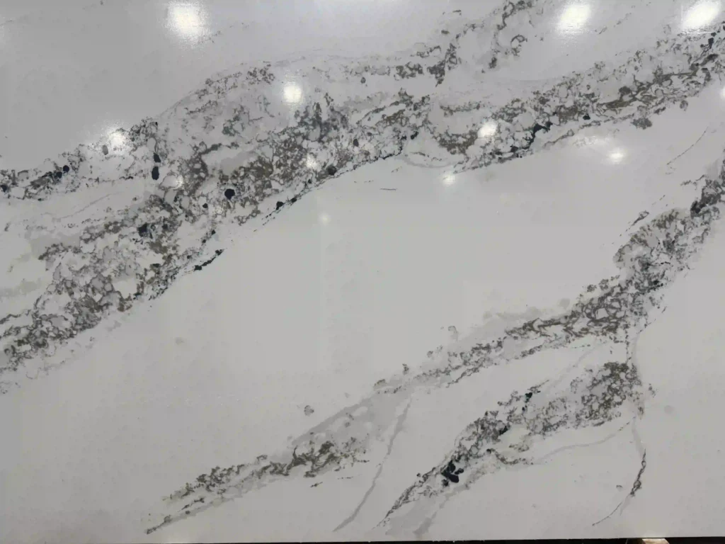 Granite countertops Quartz countertops Marble countertops Quartzite countertops Countertop installation Custom kitchen countertops Bathroom countertops Outdoor kitchen countertops Affordable countertops Luxury countertops

Kitchen Countertops granite, quartz countertops, Quartzite Countertops, Bathroom Countertops, Countertops Near me. Countertop installer. Quartz colors 

White & Light Quartz Colors
Alabaster – Soft, elegant white with a subtle warmth, perfect for creating a serene, airy atmosphere.
Antarctica – A pristine, icy white with a hint of sparkle, ideal for modern kitchen designs.
Carrara – Inspired by the luxurious Italian marble, featuring delicate veining for a sophisticated look.
Crystal White – A pure, clean white with a glossy finish, offering a sleek, minimalist vibe.
Arctic White – Cool and crisp, this white provides a bright, fresh look that makes spaces feel larger.
Pure White – A flawless white, perfect for creating a neutral and timeless aesthetic.
Snowy Mountain – Soft white with light gray undertones, mimicking the beauty of a snow-covered landscape.
Frost White – A frosty white with a matte finish that evokes a sense of calm and tranquility.
Cloud White – A warm, cloud-like white with a gentle sheen, creating a welcoming and soft atmosphere.
Polar Ice – A cool, frosty white with a subtle blue undertone, ideal for modern and contemporary designs.
Diamond White – A sparkling, radiant white that adds luxury and brightness to any space.
Winter Mist – A soft, cool white with a hint of gray, giving it a misty, ethereal quality.
Swan Lake – A creamy, soft white that mimics the elegance of swan feathers, perfect for bathrooms.
Bianco Cristallo – A clean, crystalline white with a delicate pattern, perfect for countertops that stand out.
White Sands – A warm, sandy white with soft golden hints, creating a light, coastal feel.
Lustrous White – A shiny, smooth white with a lustrous finish, adding sophistication to kitchens or baths.
Silver Mist – A cool, misty white with a touch of silver, providing an elegant, refined finish.
White Macaubas – A white quartz with grayish veins, offering a unique blend of elegance and natural beauty.
Ivory Cream – A creamy, soft ivory with a luxurious and smooth texture, ideal for creating warm, inviting spaces.
Calacatta White – Featuring bold gray veining against a white base, this color exudes luxury and timeless beauty.
Gray Quartz Colors
Concrete Gray – A modern, industrial gray that mimics the texture of concrete for a contemporary, edgy look.
Silverstone – A sophisticated silver-gray with light metallic flecks, adding a touch of glamour to countertops.
Shadow Storm – Dark gray with dramatic veining, perfect for creating a striking contrast in kitchen designs.
Platinum Gray – A refined gray with a soft metallic sheen, ideal for creating sleek, sophisticated kitchens.
Smoke Grey – A rich, smoky gray with deep undertones, perfect for contemporary, moody spaces.
Graphite – A dark, almost black gray with a smooth, matte finish that lends modern elegance to any design.
Charcoal Gray – A deep, charcoal color that adds drama and depth to any countertop, perfect for modern designs.
Cloudy Gray – A light, soft gray that gives a calm, airy feel, great for both traditional and contemporary kitchens.
Urban Grey – A modern, city-inspired gray with a balanced tone that complements various design styles.
Mystic Gray – A dark gray with rich undertones, giving an air of mystery and sophistication.
Moonlight Grey – A gentle gray with a subtle sheen, offering a soft glow that brightens any space.
Storm Grey – A deep, stormy gray with darker veining, perfect for bold, industrial-themed designs.
Cement – A neutral gray that mimics the look of cement, offering an urban, industrial vibe.
Ashen Gray – A cool, pale gray with subtle blue undertones, ideal for modern, minimalistic designs.
Flint Grey – A deeper gray with a refined, smoky hue, adding a sleek, stylish touch to any room.
Fog – A soft gray with a slightly foggy appearance, creating a relaxing, serene atmosphere.
Tungsten – A dark gray with a metallic finish, providing a striking, contemporary look.
Tornado – A deep, stormy gray that gives off a dramatic and bold presence in any setting.
Silver Tempest – A high-shine silver with dynamic veining, giving off a sense of motion and energy.
Dusty Gray – A soft, muted gray with a vintage feel, ideal for creating a timeless, understated look.
Beige & Cream Quartz Colors
Taupe – A warm beige with hints of gray, perfect for creating a neutral, inviting space.
Desert Beige – A light beige with warm undertones, giving a natural, earthy feel.
French Vanilla – A soft, creamy beige with a hint of yellow, offering a warm, inviting aesthetic.
Ivory Beige – A neutral beige with ivory undertones, offering a sophisticated and timeless design.
Oyster Pearl – A light, pearlescent beige with subtle gray undertones, perfect for modern kitchens and bathrooms.
Pebble Beige – A natural beige with gray undertones, creating a soft, organic look that complements rustic interiors.
Buttercream – A warm beige with yellow undertones, providing a soft and creamy feel.
Sandstone – A golden beige with hints of orange, offering an earthy, rustic appeal.
Cafe Latte – A rich, smooth beige with a coffee-inspired tone, perfect for cozy and inviting spaces.
Tuscany Beige – A Mediterranean-inspired beige with warm golden hues, ideal for rustic and Italian-style interiors.
Vanilla Bean – A soft, creamy beige with a touch of sweetness, perfect for neutral, versatile designs.
Mimosa – A light, sunny beige with a soft yellow tint, evoking warmth and cheerfulness.
Chai Latte – A beige with cinnamon and creamy undertones, offering a warm and soothing atmosphere.
Buttercup – A soft yellow-beige with a gentle, sunny undertone, great for creating bright, cheerful spaces.
Warm Taupe – A neutral taupe with subtle warmth, ideal for pairing with other earthy tones.
Golden Cream – A beige with golden undertones, perfect for luxurious, warm spaces.
Butter Croissant – A creamy beige with golden accents, adding a sophisticated touch to kitchens.
Cappuccino – A rich beige with coffee-colored undertones, offering a warm and cozy vibe.
Almond Butter – A soft beige with a rich, nutty tone that adds warmth to both modern and traditional designs.
Caramel – A rich, warm brownish-beige with hints of sweetness, great for creating inviting spaces.
Beige & Brown Quartz Colors
Brown Sugar – A sweet, warm brown with golden highlights, giving a rich and inviting atmosphere.
Cinnamon – A reddish-brown with a spicy tone, perfect for adding warmth and depth to your kitchen.
Café Mocha – A dark brown with velvety texture, ideal for creating a luxurious, grounded design.
Caramel Spice – A smooth caramel brown with a slight spice, offering a warm, sophisticated feel.
Maple Spice – A brown with a reddish tint, reminiscent of maple trees, perfect for cozy kitchens.
Café Brown – A deep, rich brown, perfect for rustic and traditional-style kitchens.
Fossil Brown – A muted, earthy brown with subtle speckling, giving it a natural stone-like appearance.
Cedar Brown – A rich, wood-inspired brown with red undertones, ideal for warm, natural spaces.
Golden Brown – A warm, golden-toned brown, adding a cozy feel to your kitchen or bathroom.
Toffee – A sweet, rich brown with buttery hints, perfect for creating a warm and luxurious space.
Sable Brown – A dark brown with cool undertones, ideal for creating a sophisticated and bold aesthetic.
Autumn Brown – A warm brown with orange and yellow highlights, evoking a fall-inspired palette.
Walnut – A dark, rich brown that adds depth and sophistication, great for traditional designs.
Maple Brown – A medium-toned brown with reddish undertones, perfect for creating a warm, inviting atmosphere.
Truffle – A dark, earthy brown with subtle undertones, perfect for creating a chic, modern look.
Cognac – A rich, amber brown with a smooth texture, ideal for luxurious and elegant interiors.
Ebony – A deep, dark brown with a cool undertone, perfect for a dramatic and refined look.
Mochaccino – A coffee-colored brown with creamy undertones, great for creating a soothing, cozy atmosphere.
Sienna Brown – A reddish-brown with rustic, earthy undertones, perfect for warm, natural designs.
Cinnamon Swirl – A warm, golden brown with cinnamon undertones, offering a comforting and inviting feel.
Black Quartz Colors
Jet Black – A deep, pure black, perfect for sleek, high-end designs.
Midnight Black – A rich black with a glossy finish, ideal for luxurious and modern spaces.
Black Diamond – A jet-black color with sparkling specks, giving a touch of glamour and drama.
Onyx – A deep black with a glossy finish, perfect for bold and elegant designs.
Carbon Black – A smooth, matte black, ideal for contemporary and minimalist spaces.
Unique Quartz Colors
Crystal Storm – A light gray quartz with silver streaks and sparkles, creating a stormy, dynamic look.
Lava Flow – A fiery red quartz with black veining, perfect for creating a bold statement.
Blue Ice – A soft, icy blue quartz with frosty undertones, ideal for a fresh, modern look.
Tropical Breeze – A cool blue-green quartz with subtle veining, evoking a tropical coastal feel.
Emerald Forest – A deep green quartz with rich flecks, perfect for creating a natural, earthy vibe.
Golden Nugget – A rich gold with brown speckles, creating a luxurious and warm countertop.
Twilight Glow – A deep purple with subtle iridescent specks, perfect for adding a mystical touch.
Autumn Leaves – A warm orange-brown with red veins, mimicking the colors of fall leaves.
Coral Reef – A soft coral-colored quartz with light marbling, perfect for kitchens with a coastal vibe.
Sapphire Dreams – A blue quartz with swirls of white, creating a dreamy, serene atmosphere.
Lavender Mist – A soft purple with cool undertones, perfect for a calming, modern look.
Garnet Sparkle – A deep red quartz with sparkling flecks, perfect for adding drama and luxury.
Amethyst Blaze – A rich, purple quartz with veining that evokes the look of precious stones.
Golden Horizon – A warm, golden quartz with streaks of white and amber, perfect for a welcoming vibe.
Iridescent White – A shimmering white quartz with subtle color-changing effects, adding elegance and sophistication.