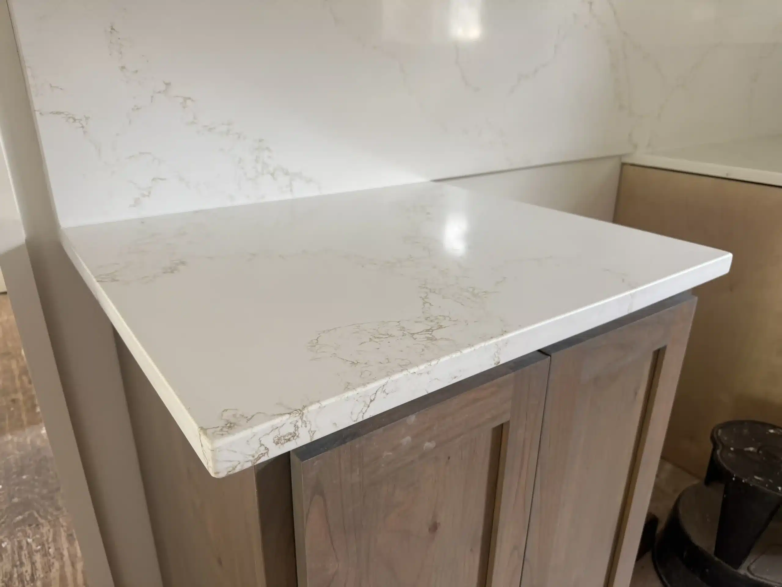 Custom tile shower walls and marble accents for a designer bathroom renovation.