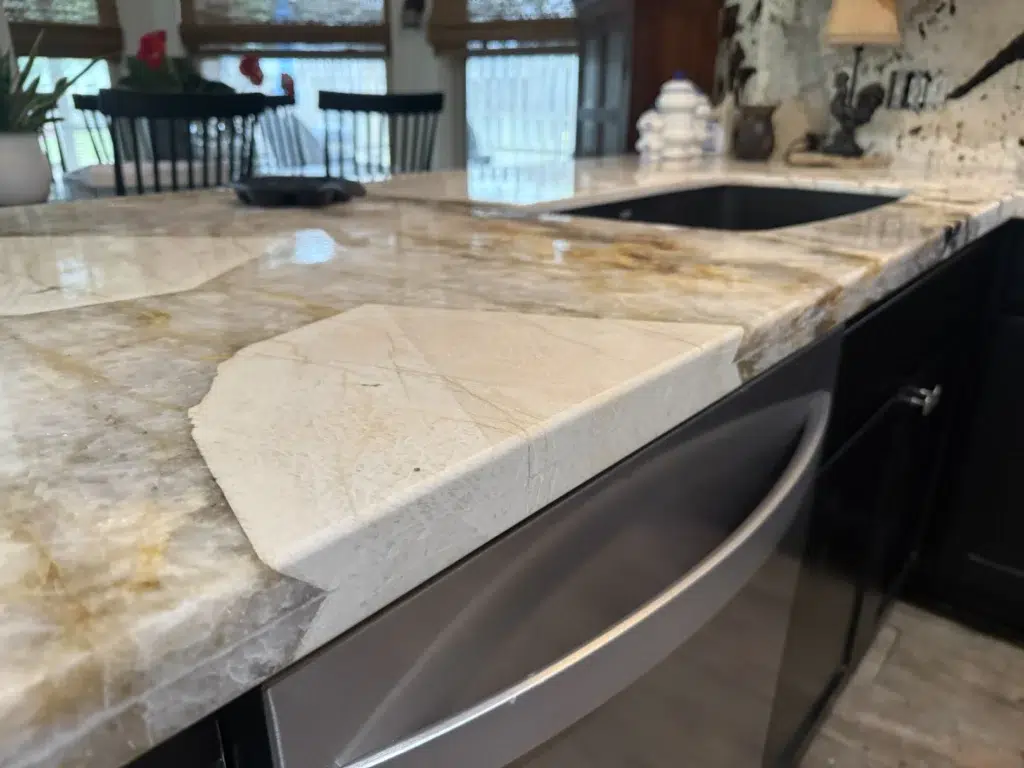 Taj Mahal Quartzite countertop with farmhouse sink